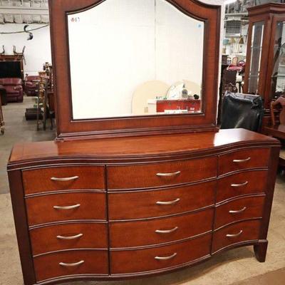 Lot: 579 - Traditional mahogany finish 12 drawer serpentine

Traditional mahogany finish 12 drawer serpentine low chest with arch beveled...