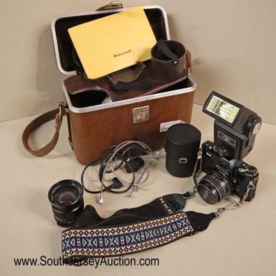 Lot: 550 - VINTAGE Pentax Honeywell 35 mm camera in original

VINTAGE Pentax Honeywell 35 mm camera in original case with lens and other...