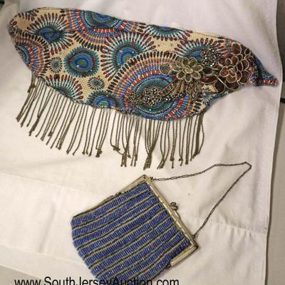 Lot: 520 - 2 piece vintage lot including beaded blue purse

2 piece vintage lot including beaded blue purse and a neck shaw with hanging...