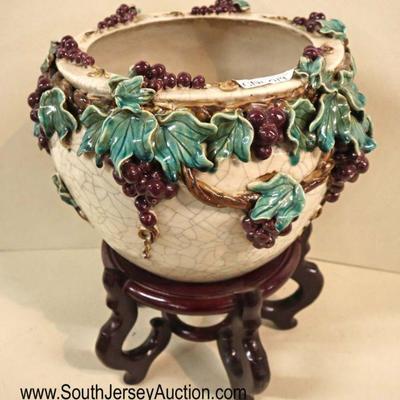 Lot: 555 - Majolica style planter on wood stand with grapes

Majolica style planter on wood stand with grapes and vines
