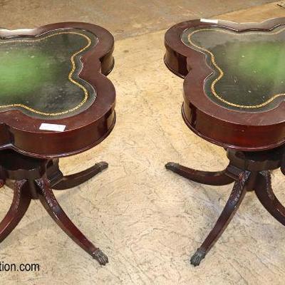 Lot: 652 - PAIR of VINTAGE mahogany clover shape leather top

PAIR of VINTAGE mahogany clover shape leather top carved leg lamp tables
