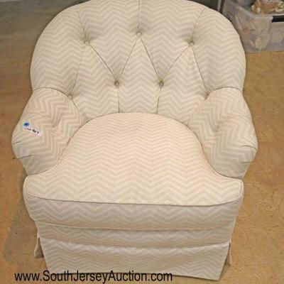 Lot: 436 - Contemporary button tufted swivel club chair

Contemporary button tufted swivel club chair
