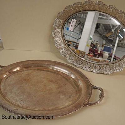 Lot: 560 - Group lot of 2 silver plate serving tray and

Group lot of 2 silver plate serving tray and silver plate mirrored serving tray
