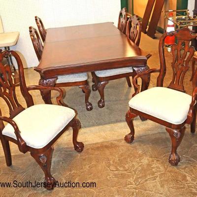 Lot: 632 - 7 piece Traditional ball and claw with shell

7 piece Traditional ball and claw with shell carved legs dining room table with...
