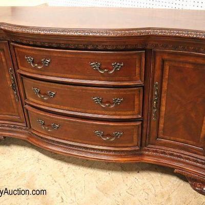 Lot: 595 - FANCY carved burl mahogany 3 drawer 2 door banded

FANCY carved burl mahogany 3 drawer 2 door banded buffet by Art Furniture

