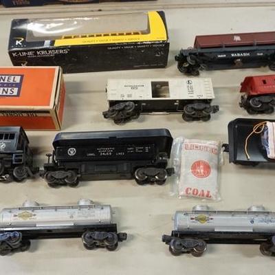 1016	9 PC TRAIN CAR LOT INCLUDING ARMY #41 SWITCHER W/BOX, COAL CARS, SUNOCO TANKERS, 2257 CABOOSE, K-LINE SCHOOL BUS, ETC
