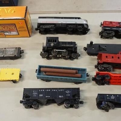 1017	12 PC LOT INCLUDING RAIL KING CAR IN BOX, CRANE CAR, HELICOPTER CAR-ALL LIONEL & A KUSAN DUMMY
