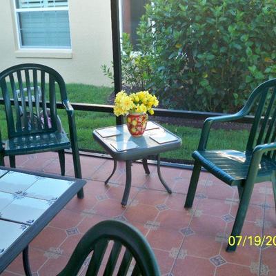 Patio End Table, 2 - Green Plastic chairs