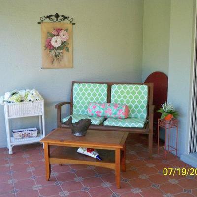 Wood Patio Loveseat with Cushions, Wood Coffee table, White Wicker Plant stand.