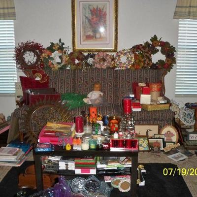 Sofa, Wreaths, Candles, Coffee table.