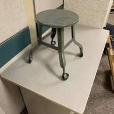 Gray metal stool with wheels