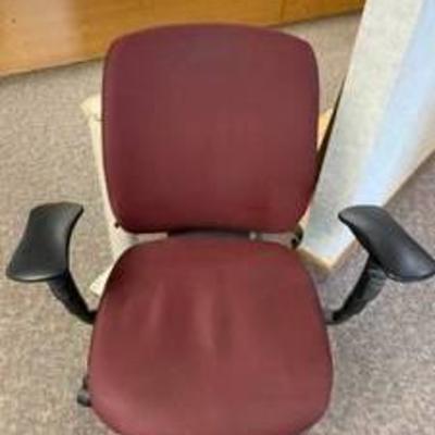 Red cloth office chair with wheels