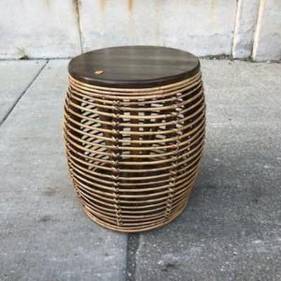 wicker accent table with a wooden top