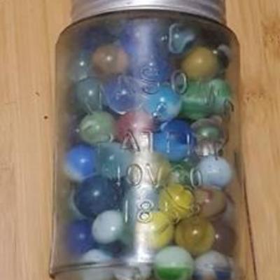 Approximately 125 marbles in Pint jar
