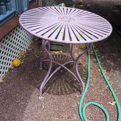 pink wrought iron table
$85