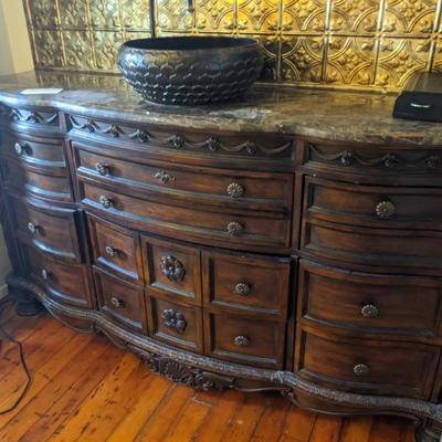 marble top sideboard/sink retrofitted for sink pipes. 6 and 1/2 functioning drawers, metal pulls, carved scrolled corners
72