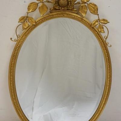 1043	CARVERS GUILD OVAL BEVELED MIRROR W/FLOWER & LEAF CREST, 40 IN X 23 1/4 IN
