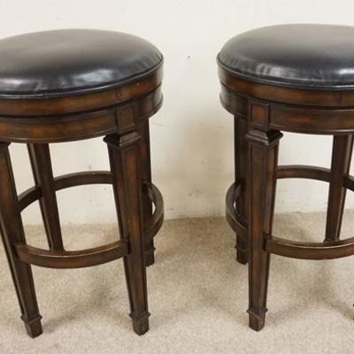 1064	PAIR OF LEATHER STOOLS W/REVOLVING SEATS, 30 IN HIGH, 19IN DIAMETER
