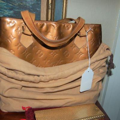Louis Vuitton handbag in cloth bag