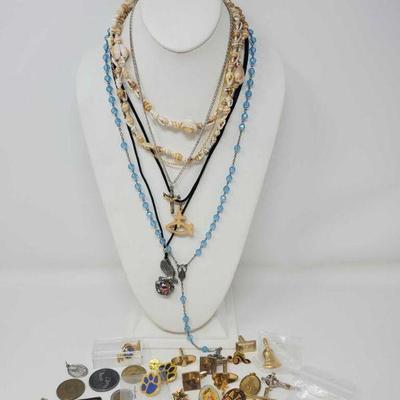 552	

Costume Jewelry
Includes Pins, Tie Pins, Necklaces, Coins and more!