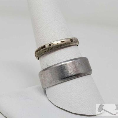 556	

2 Wedding Bands
Size Includes 7.5, 11