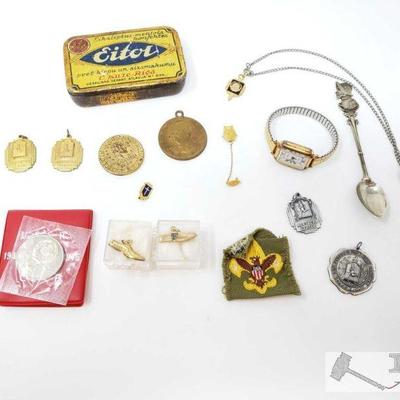 650	

U.S.S.R Coin, Cross Country Pendants, Decorative Spoon, Timex Watch, And More
U.S.S.R Coin, Cross Country Pendants, Decorative...