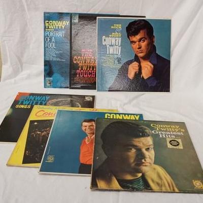 1034	LOT OF SEVEN CONWAY TWITTY ALBUMS; PORTRAIT OF A FOOL, THE COUNTRY TWITTY TOUCH, THE ROCK & ROLL STORY, GREATEST HITS, LONELY BLUE...