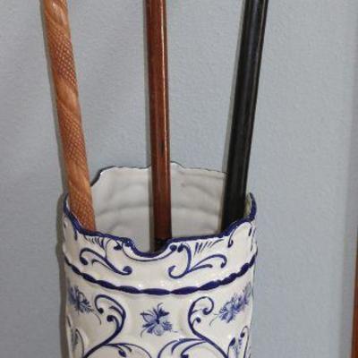 Hand Painted Blue and White Porcelain Umbrella Stand shown with a Collection of 3 walking canes.