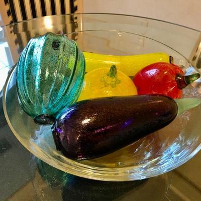 Circular Glass Bowl containing five colored glass vegetables. 
