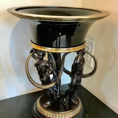 Pair of black marble and brass female fiqural base compotes, each with ormolu trim. Heights: 14 1/2