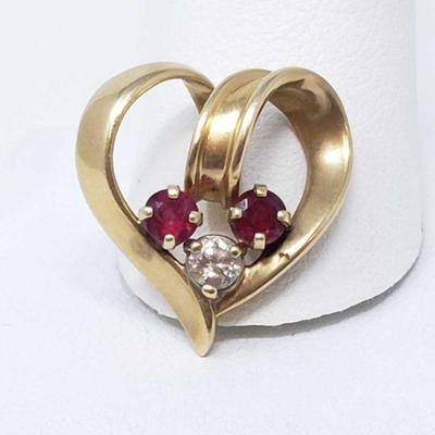 642	

14k Gold Pendant With Diamond And Rubies, 3.2g
Weighs Approx 3.2g