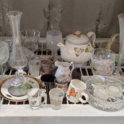 4122	

1 Shelf Full Of Glassware Includes Shot Glasses, Wine Glasses, and More!
Also Includes Candle Holders, Tea Pot, A Vase, and More!