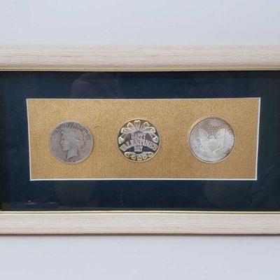 453	

Framed Silver Peace Dollar and 2 Fine Silver Coins
Frame Measures Approx 11