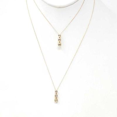 629	

2 10k Gold Chains With Diamond Pendants, 2.3g
Weighs Approx 2.3g
