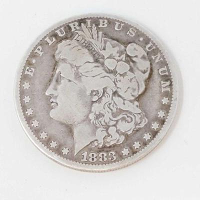 820	

Morgan Silver Dollar- 26.03g
Weighs Approx 26.03g