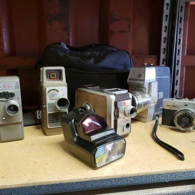 6032	

4 Video Cameras And Camera
Olympus 35 RC Holiday 8MM Bell & Howell Electric Eye Kodak Brownie Movie Camera 8MM Bell & Howell...