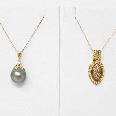 594	

14k Gold Pendant With Diamond And 14k Gold Pendant With South Sea Cultured Pearl
Weighs Approx 5.3g