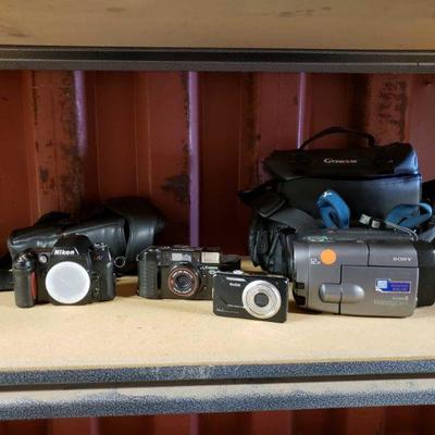 6016	

3 Cameras And Video Camera
Nikon N80 Cannon Quartz D Kodak Easy Share M830 Sony Video 8 Handy Cam 2 Carring Cases