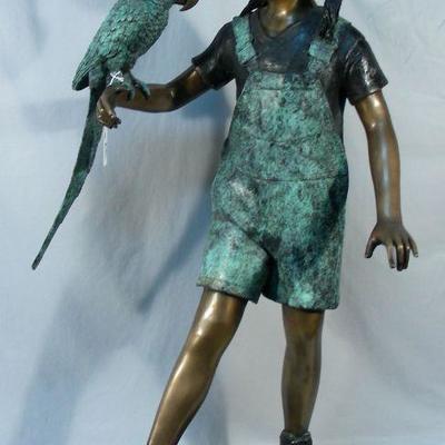 Bronze sculpture of young girl with parrot