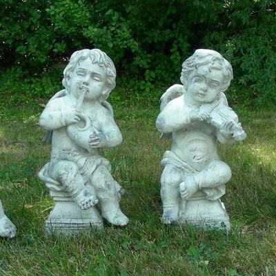 Group of four composition stone garden sculptures