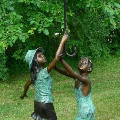 Bronze sculpture/fountain of 2 children with umbrella