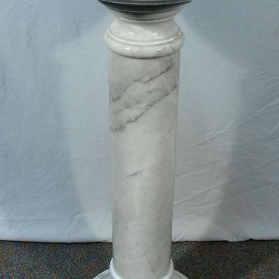 One of two marble pedestals