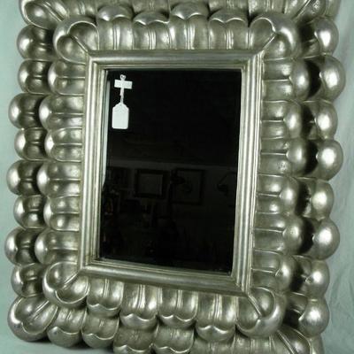 One of two silver framed mirrors