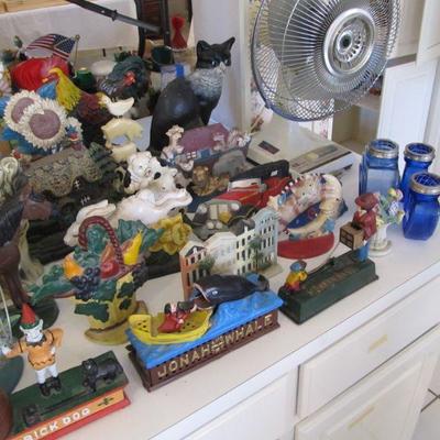 A large collection of door stops & coin banks in all themes.