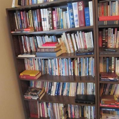 A large collection of religious, rare, spiritual books, & Bibles.  Plus several nice wood shelves for storage.