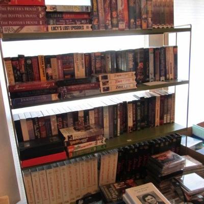 A large collection of religious, rare, spiritual books, & Bibles.  Plus several nice wood shelves for storage.