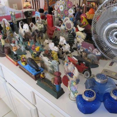 A large collection of door stops & coin banks in all themes.
