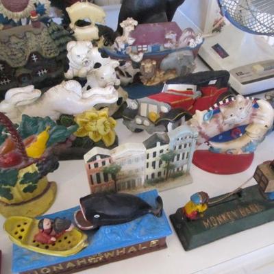 A large collection of door stops & coin banks in all themes.