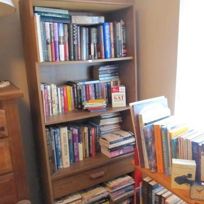 A large collection of religious, rare, spiritual books, & Bibles.  Plus several nice wood shelves for storage.