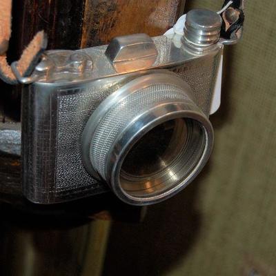 Silver flask shaped like camera